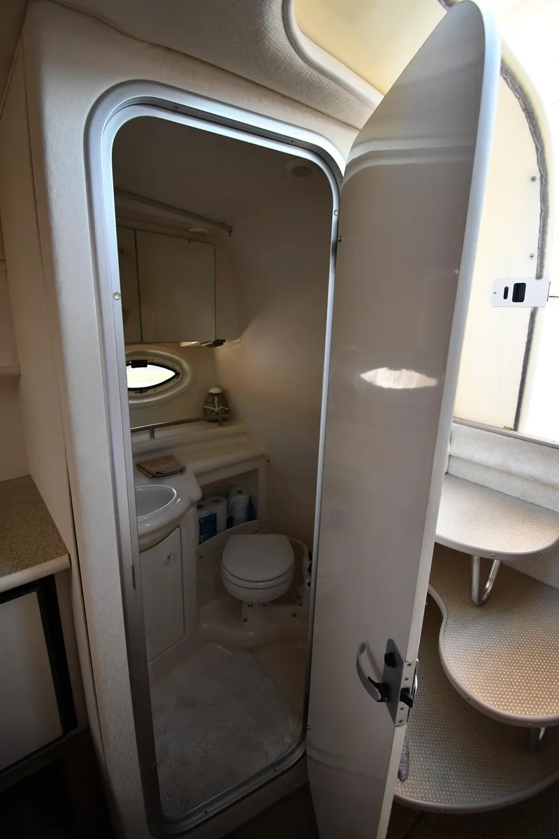 Slide: The Image of 2000 Maxum 2700 SCR boat bathroom interior with compact design and amenities. - 39