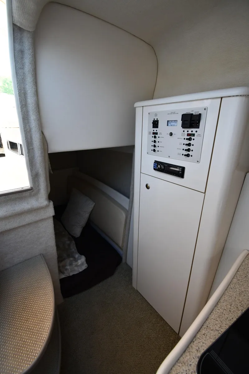 Slide: The Image of 2000 Maxum 2700 SCR cabin interior with control panel and seating area. - 41