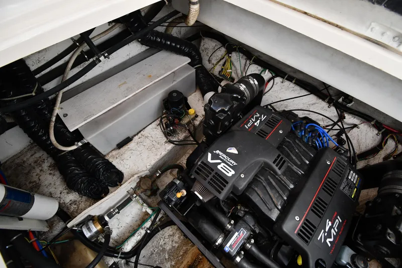 Slide: The Image of Engine compartment of 2000 Maxum 2700 SCR boat featuring a V8 engine. - 47