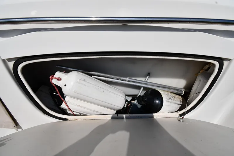 Slide: The Image of Storage compartment of 2000 Maxum 2700 SCR boat with fenders and equipment. - 49