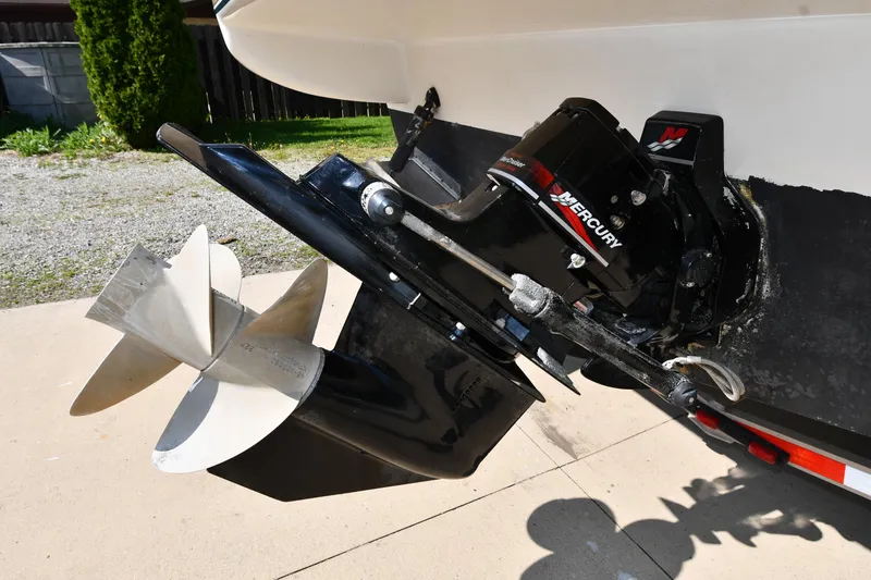 Slide: The Image of Outboard motor of 2000 Maxum 2700 SCR boat with Mercury branding, showing propeller detail. - 8