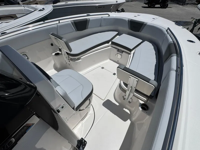 Slide: The Image of 2025 Robalo R270 Center Console boat interior with sleek seating and modern design. - 21