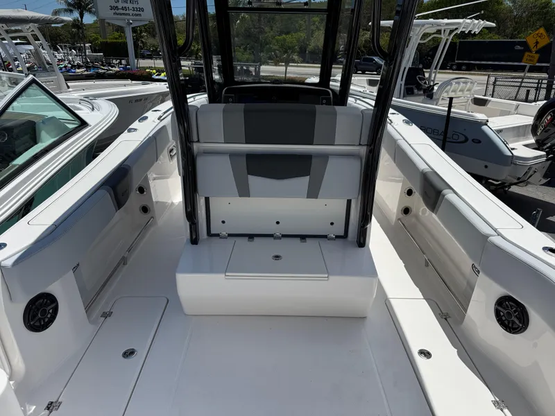 Slide: The Image of 2025 Robalo R270 Center Console boat interior with seating and storage compartments. - 4