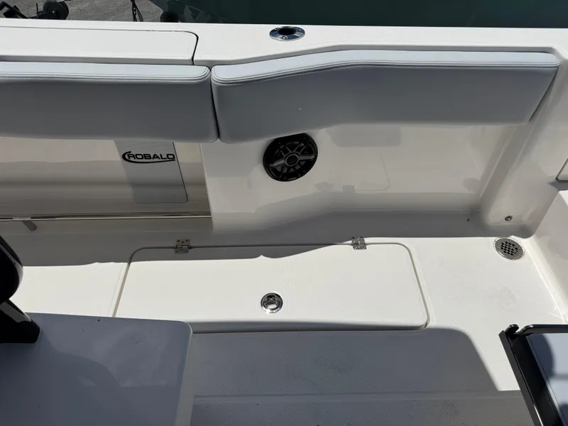 Slide: The Image of 2025 Robalo R270 Center Console boat interior with seating and speaker. - 8