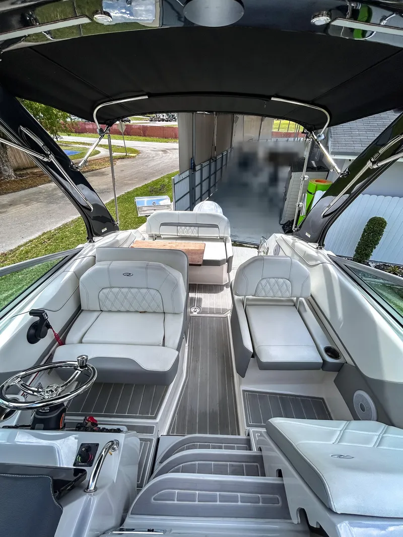 Slide: The Image of 2023 Regal 26 XO boat interior with sleek seating and modern design. - 8