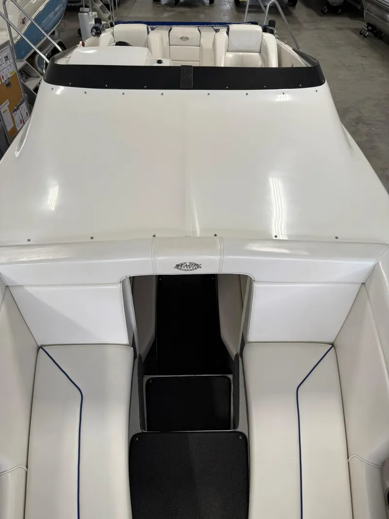 Slide: The Image of 2006 Magic 29 Wizard boat interior with white seating and sleek design. - 27