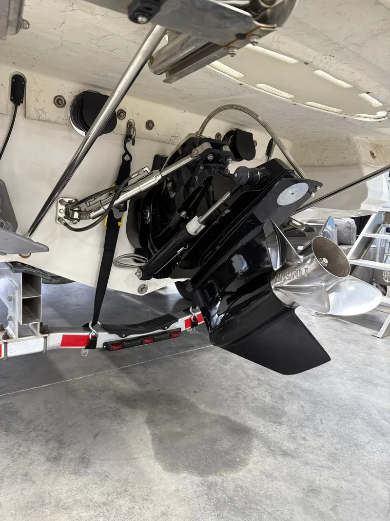 Slide: The Image of 2006 Magic 29 Wizard boat stern drive and propeller on trailer. - 4