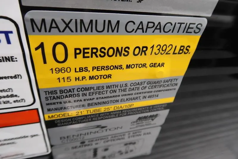 Slide: The Image of 2025 Bennington S Swingback 22 SSB Limited capacity label: 10 persons, 1392 lbs, 115 HP motor. - 14