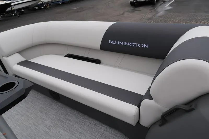 Slide: The Image of 2025 Bennington S Swingback 22 SSB Limited boat interior with sleek, modern seating design. - 19