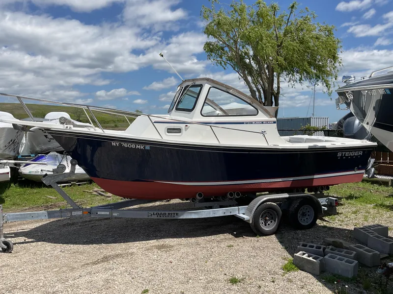 Slide: The Image of 2015 Steiger Craft 21 DV Block Island boat on trailer, parked outdoors. - 1