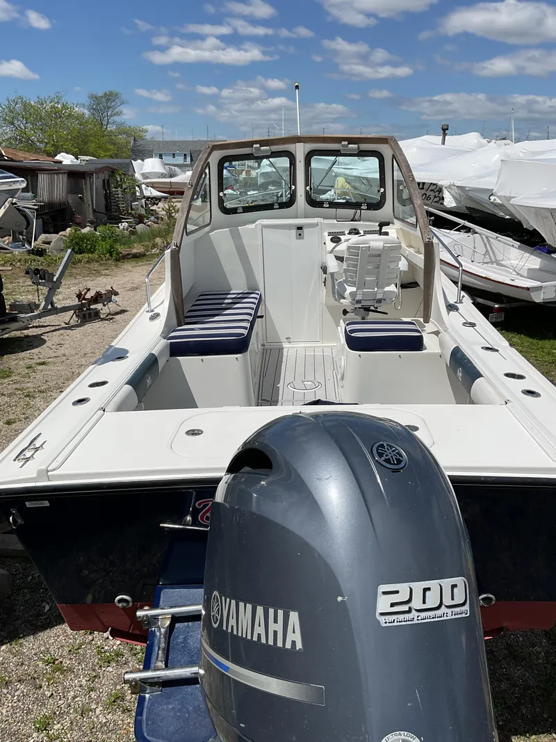 Slide: The Image of 2015 Steiger Craft 21 DV Block Island boat with Yamaha 200 engine, docked outdoors. - 13
