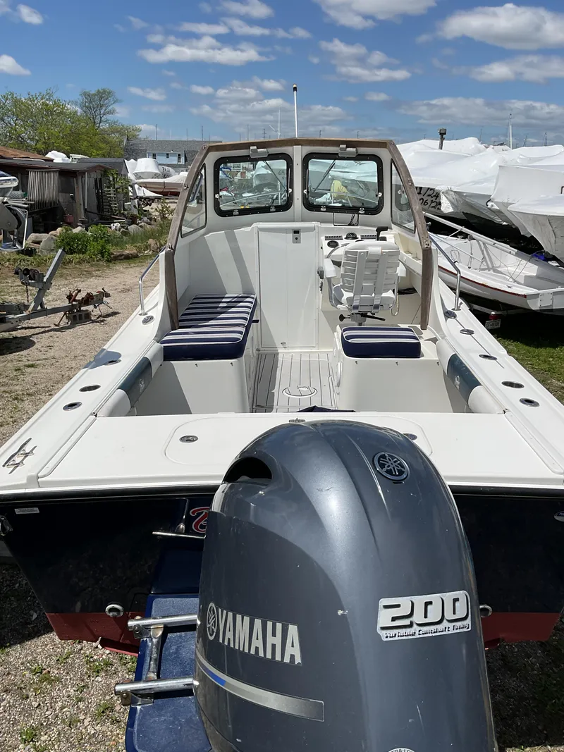 Slide: The Image of 2015 Steiger Craft 21 DV Block Island boat with Yamaha 200 engine, docked outdoors. - 14