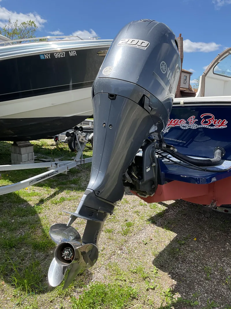 Slide: The Image of 2015 Steiger Craft 21 DV Block Island boat with outboard motor, parked on grass. - 16