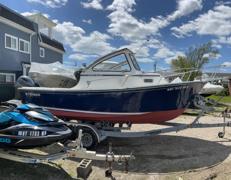 Slide: The Image of 2015 Steiger Craft 21 DV Block Island boat on trailer, parked outdoors. - 4
