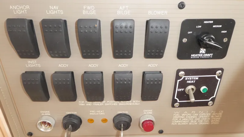 Slide: The Image of Control panel of 1996 Bayliner 3488 Avanti Command Bridge with switches and heater controls. - 11