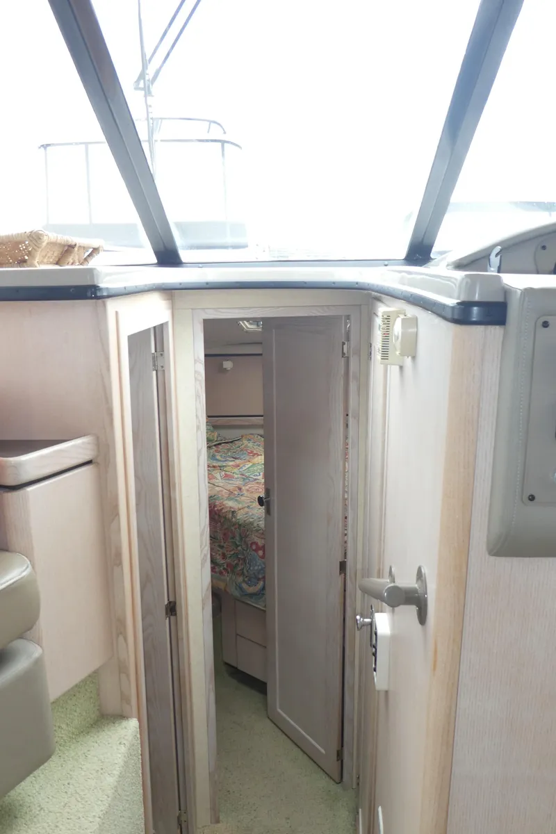 Slide: The Image of 1996 Bayliner 3488 Avanti Command Bridge interior cabin entrance with natural light. - 13