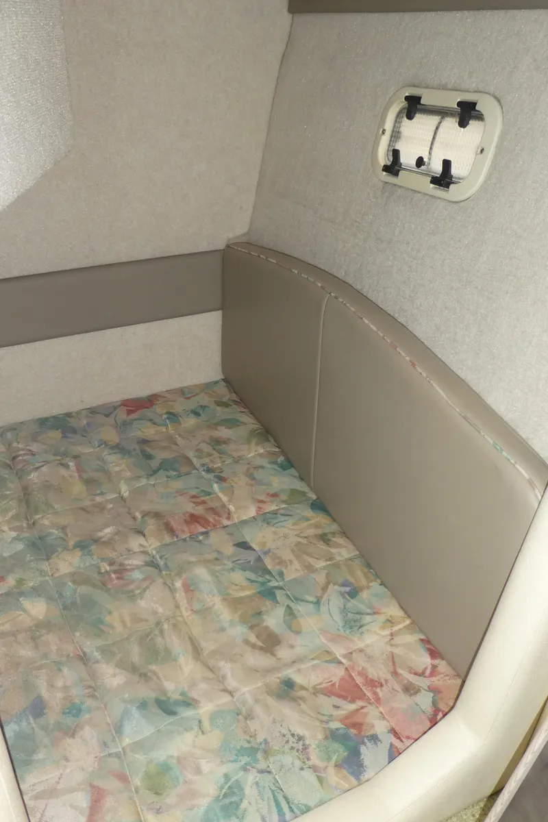 Slide: The Image of 1996 Bayliner 3488 Avanti Command Bridge cabin interior with patterned bedding. - 21