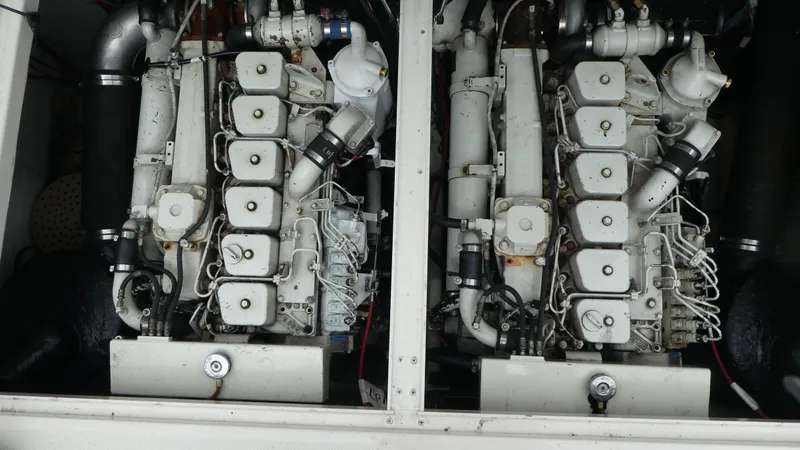 Slide: The Image of Engine room of 1996 Bayliner 3488 Avanti Command Bridge with dual engines. - 28