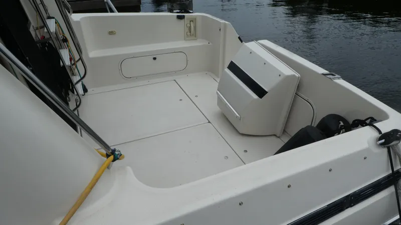 Slide: The Image of 1996 Bayliner 3488 Avanti Command Bridge boat deck, spacious and clean design. - 3