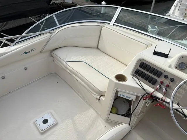 Slide: The Image of 1996 Bayliner 3488 Avanti Command Bridge interior with seating and control panel. - 35