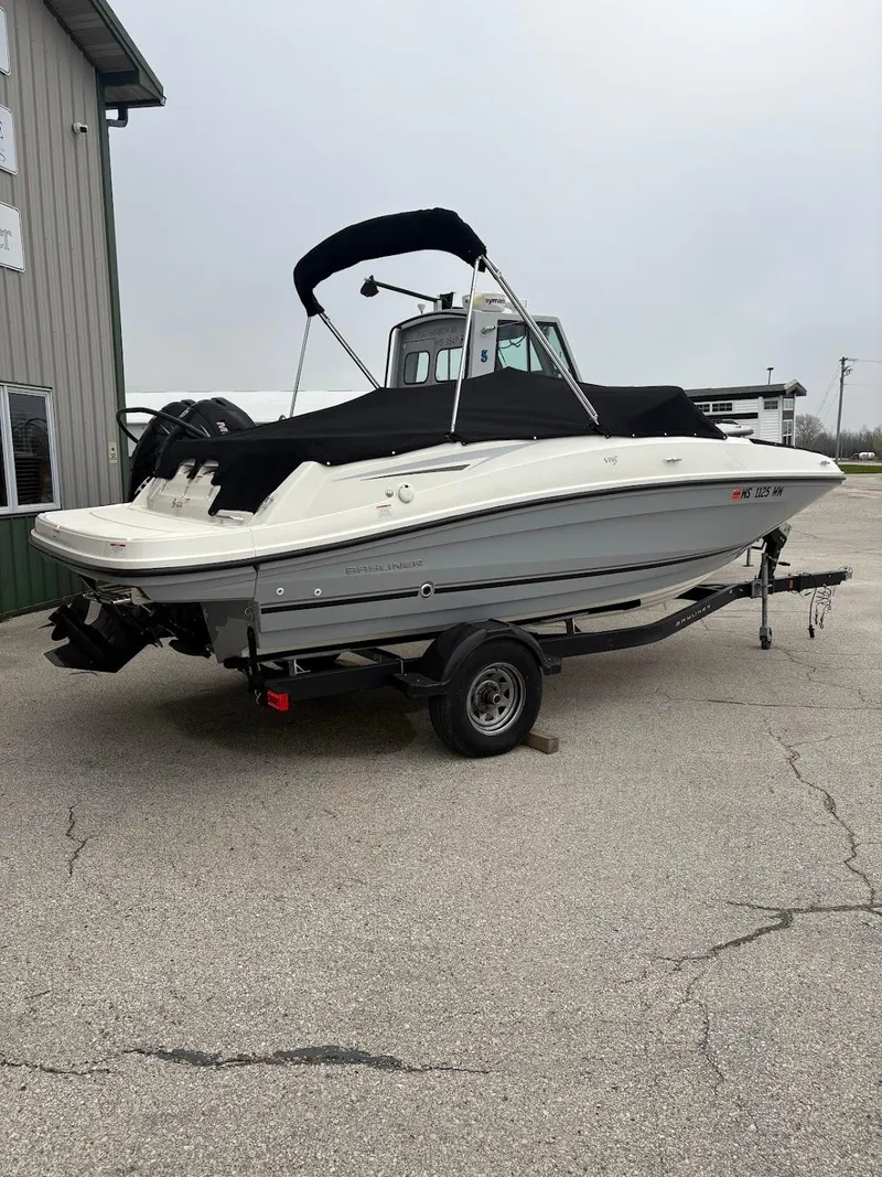 Slide: The Image of 2017 Bayliner VR5 Bowrider boat on trailer, parked outdoors. - 0