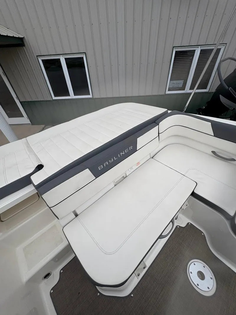 Slide: The Image of 2017 Bayliner VR5 Bowrider boat interior with white seating and gray accents. - 11