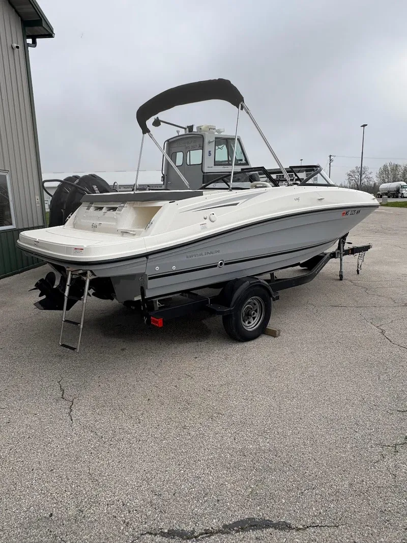 Slide: The Image of 2017 Bayliner VR5 Bowrider boat on trailer, parked outdoors. - 14