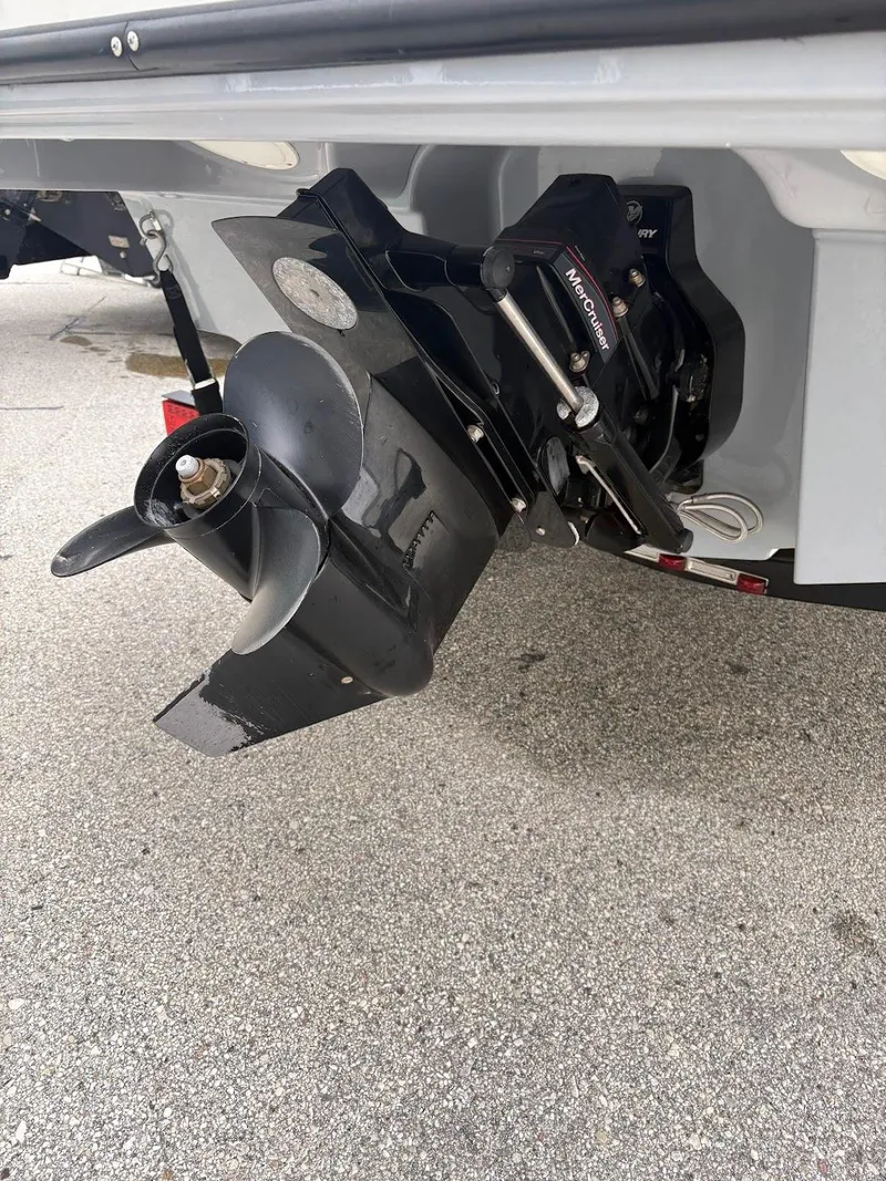 Slide: The Image of 2017 Bayliner VR5 Bowrider boat propeller and outdrive on pavement. - 15