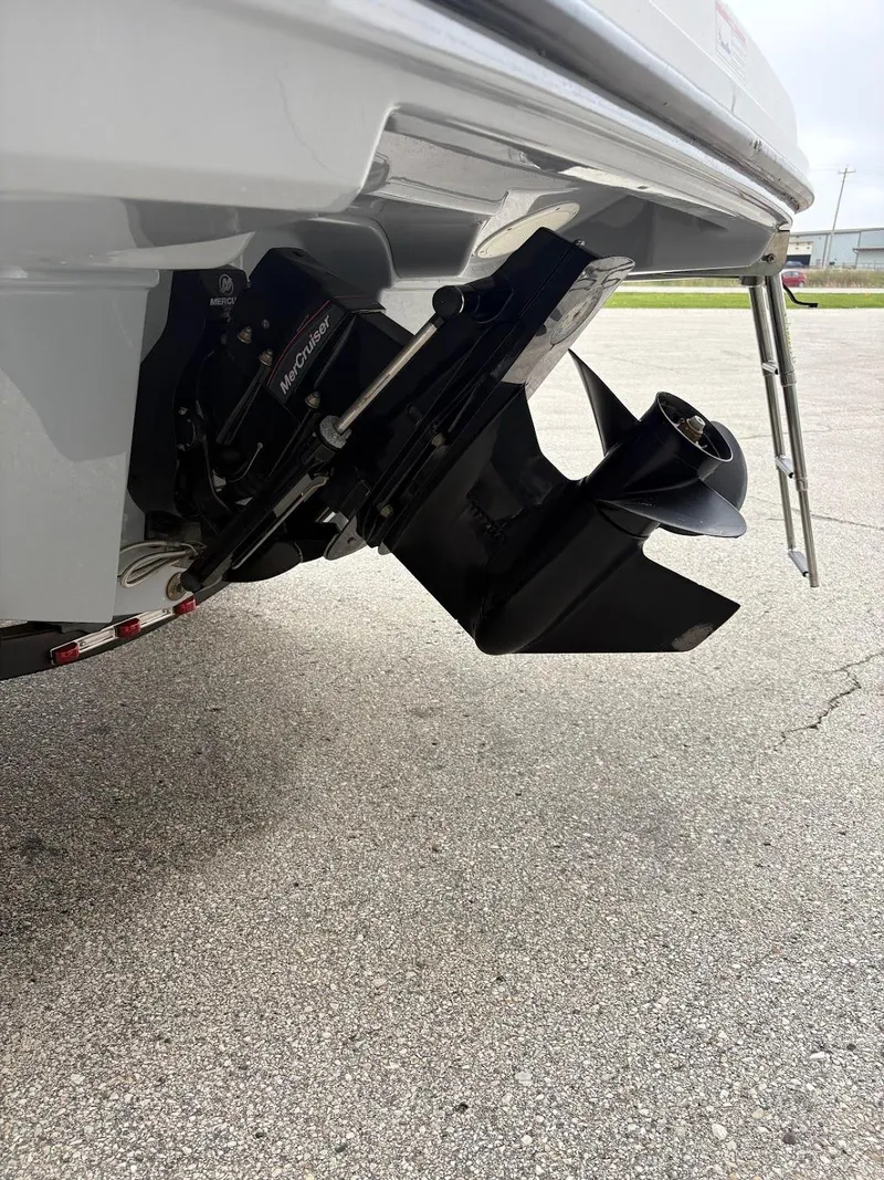 Slide: The Image of 2017 Bayliner VR5 Bowrider outboard motor and propeller on pavement. - 3