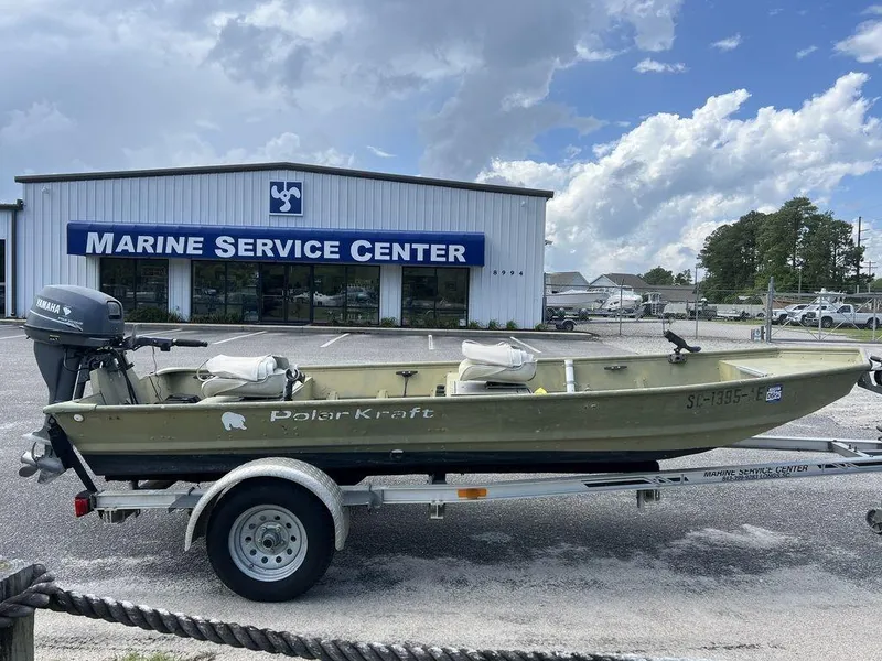 Slide: The Image of 1989 Polar Kraft 15' Jon boat on trailer outside Marine Service Center. - 4