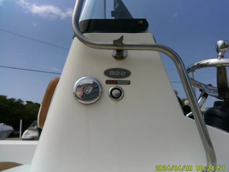 Slide: The Image of 2015 Sundance B22CCR boat console with steering wheel and control panel. - 6