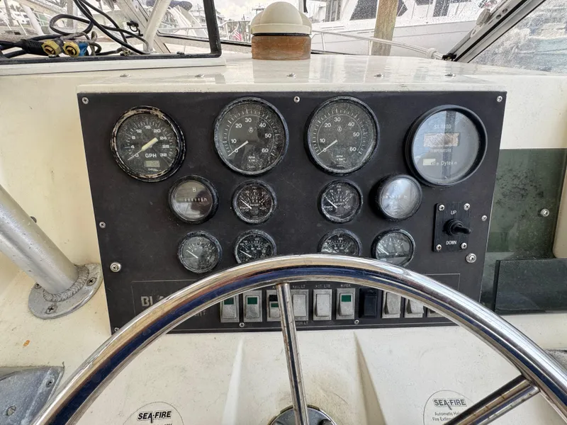 Slide: The Image of 1985 Blackfin 29 Combi Express dashboard with gauges and steering wheel. - 12