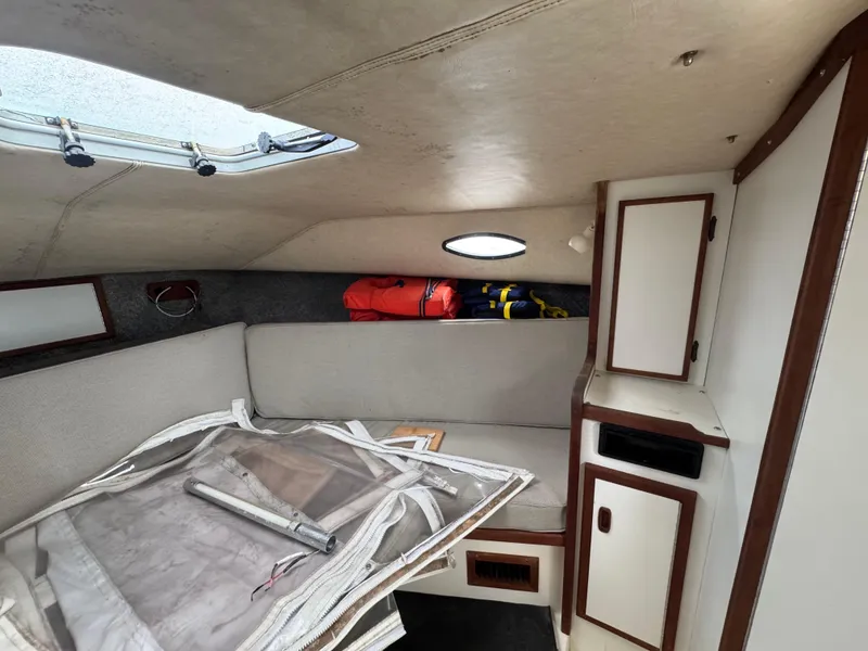 Slide: The Image of Interior of 1985 Blackfin 29 Combi Express boat with seating and storage. - 7