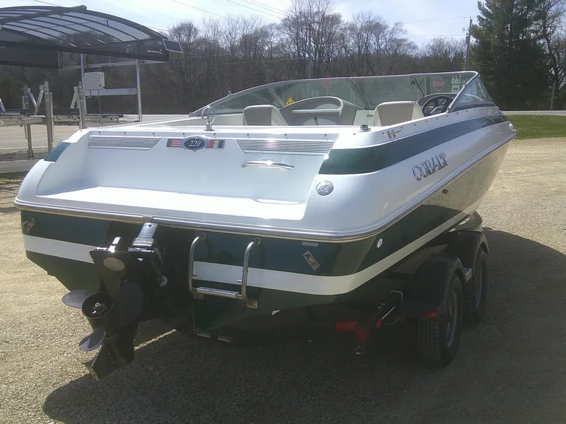 Slide: The Image of 1998 Cobalt 220 boat on trailer, parked outdoors, rear view. - 3
