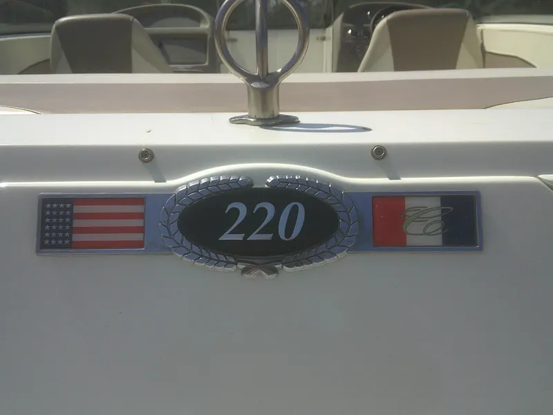 Slide: The Image of Cobalt 220 boat emblem with American and French flags, 1998 model. - 4