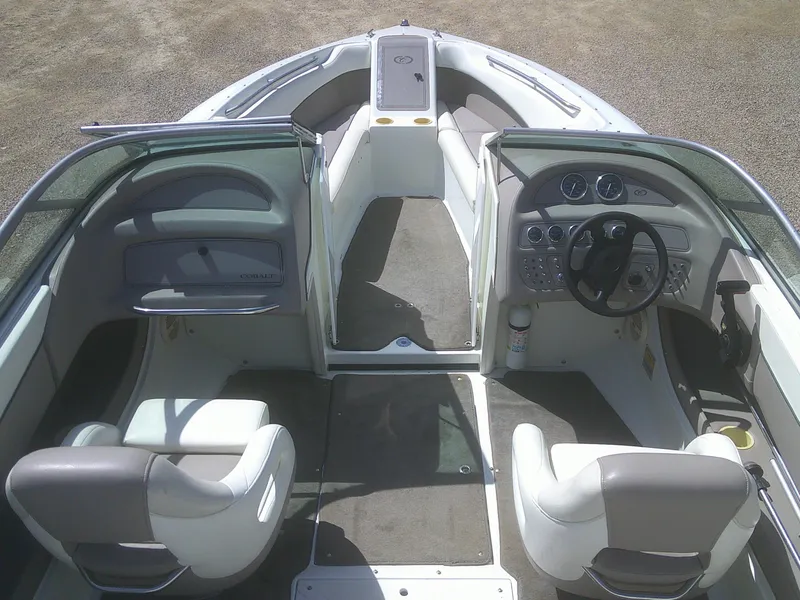 Slide: The Image of 1998 Cobalt 220 boat interior with steering wheel, seats, and dashboard controls. - 5