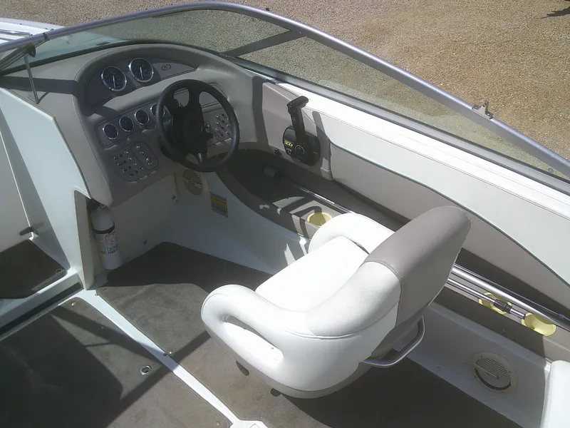 Slide: The Image of Interior of a 1998 Cobalt 220 boat showing steering wheel and dashboard controls. - 9