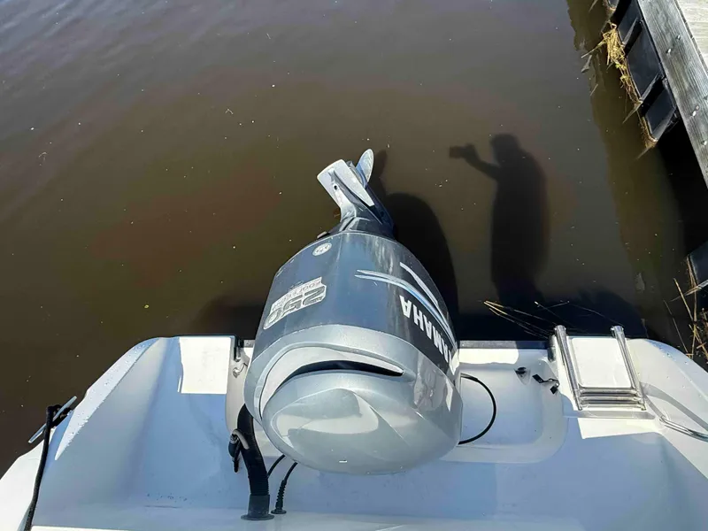 Slide: The Image of 2005 Seaswirl Striper 2601 Walkaround O/B with Yamaha outboard motor at dock. - 7