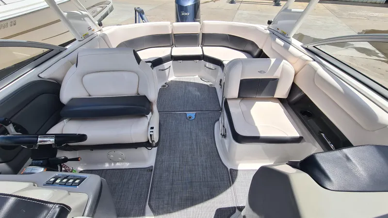 Slide: The Image of 2018 Chaparral Suncoast 250 Deluxe boat interior with spacious seating and modern design. - 10