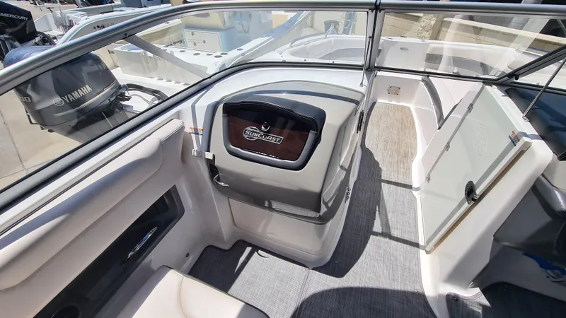 Slide: The Image of 2018 Chaparral Suncoast 250 Deluxe boat interior with seating and glass door. - 12