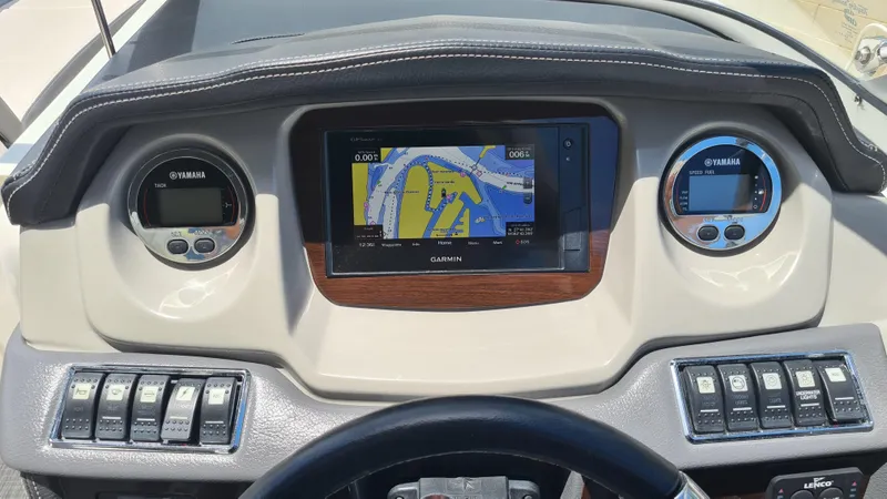 Slide: The Image of Dashboard of 2018 Chaparral Suncoast 250 Deluxe with Garmin navigation system and Yamaha gauges. - 15