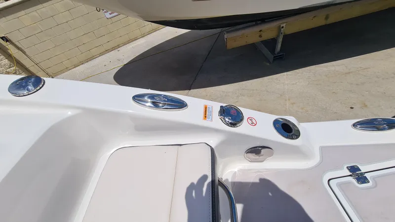 Slide: The Image of 2018 Chaparral Suncoast 250 Deluxe boat interior with seating and control panel. - 27