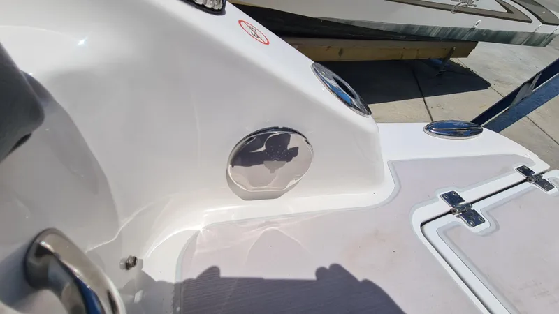 Slide: The Image of 2018 Chaparral Suncoast 250 Deluxe boat deck with stainless steel fixtures. - 28