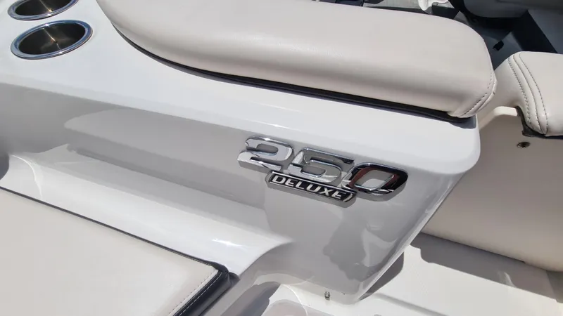 Slide: The Image of 2018 Chaparral Suncoast 250 Deluxe boat interior with logo and seating. - 30