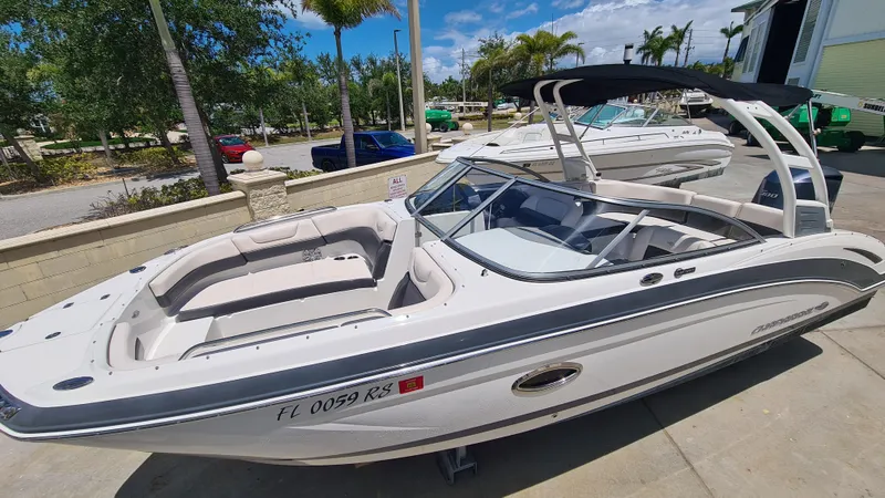 Slide: The Image of 2018 Chaparral Suncoast 250 Deluxe boat with sleek design, docked outdoors. - 6