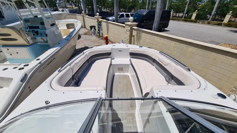 Slide: The Image of 2018 Chaparral Suncoast 250 Deluxe boat with spacious seating and sleek design. - 8