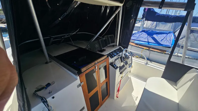 Slide: The Image of 1992 Luhrs Tournament 300 boat cockpit with steering wheel and control panel. - 16