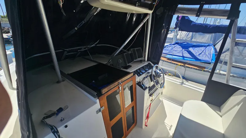 Slide: The Image of 1992 Luhrs Tournament 300 boat interior with steering wheel and control panel. - 23