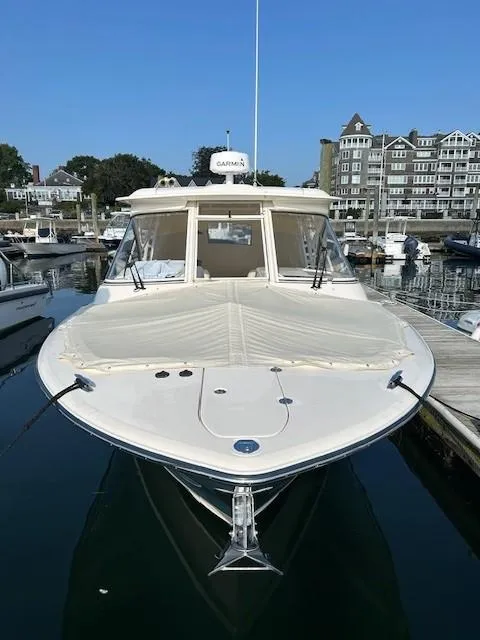 Slide: The Image of 2020 Grady-White Freedom 325 boat docked in a marina, front view. - 17