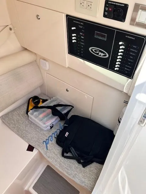 Slide: The Image of 2020 Grady-White Freedom 325 cabin interior with control panel and storage area. - 23